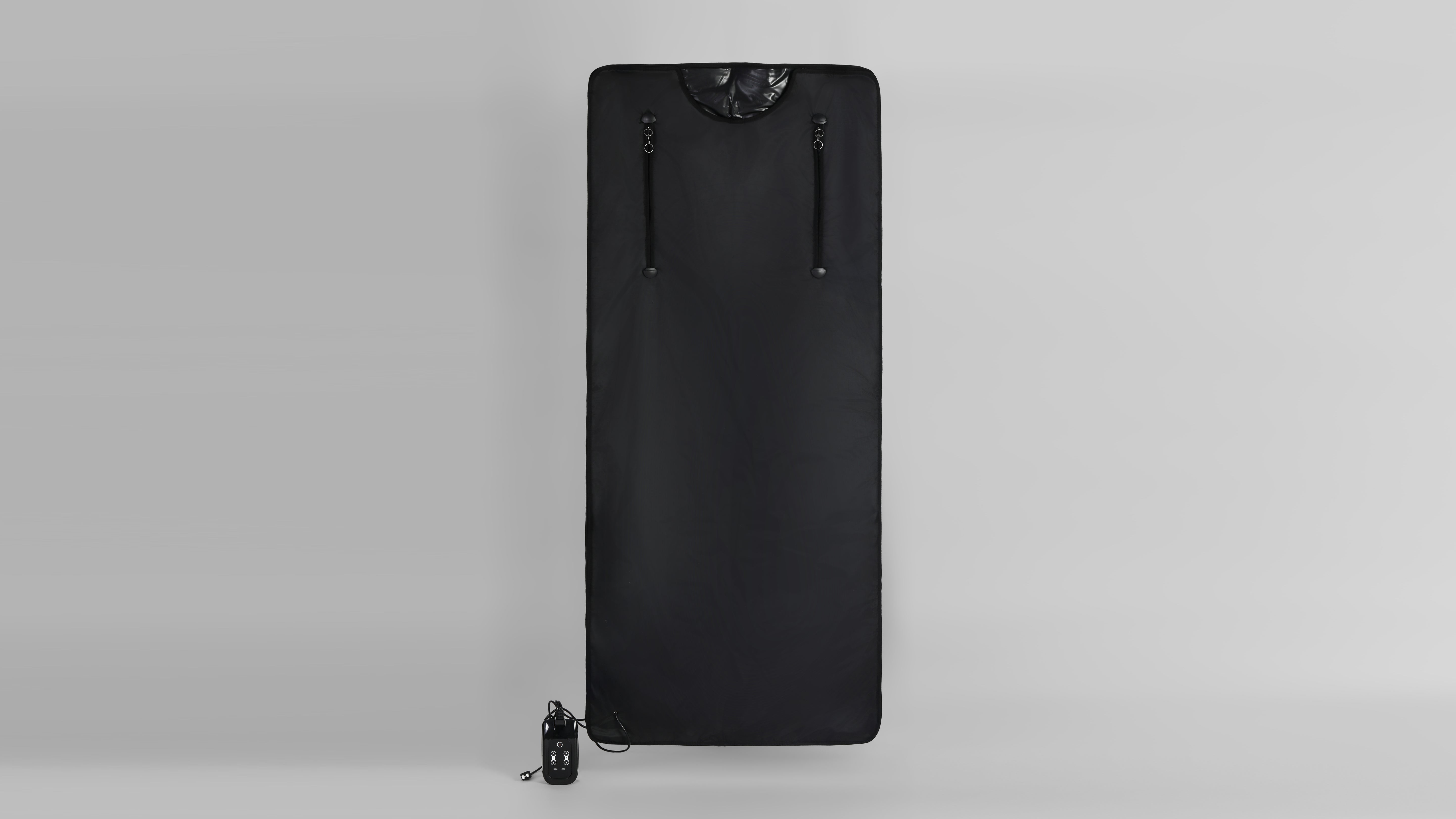 Black Oxford infrared sauna blanket fully extended, featuring vertical zippers for access, control panel with buttons, and power cord for heat therapy.