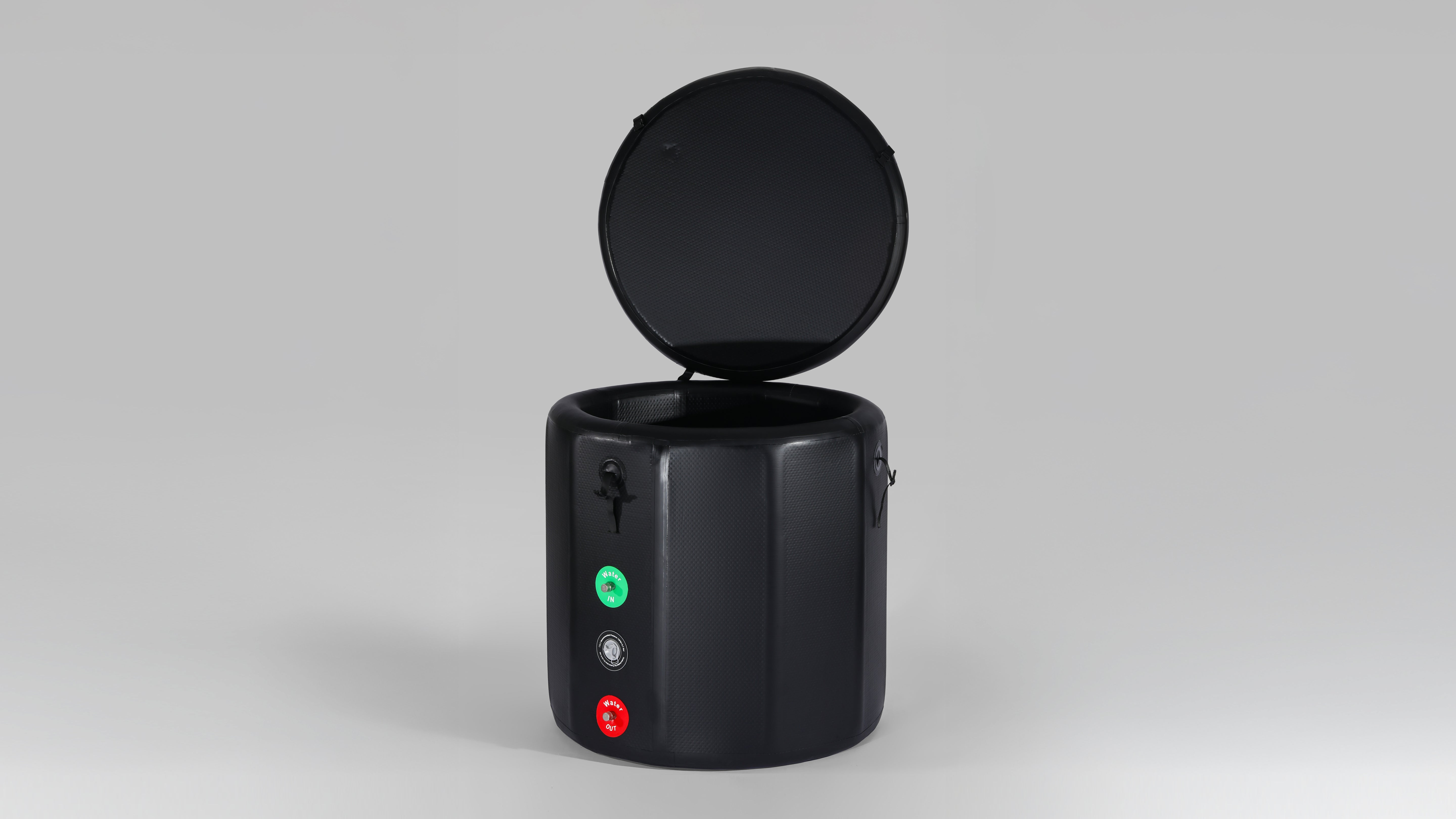 A black inflatable multi - sided ice bath tub with opening lid, featuring inlet and outlet valves for water flow control.